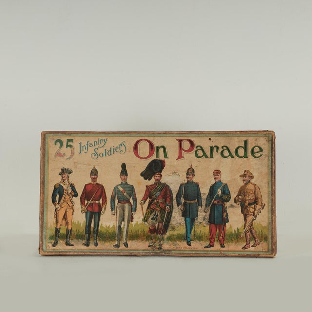 Transporting set of 25 Infantry Soldiers on Parade presented in the original cardboard box with a colorful printed image,...