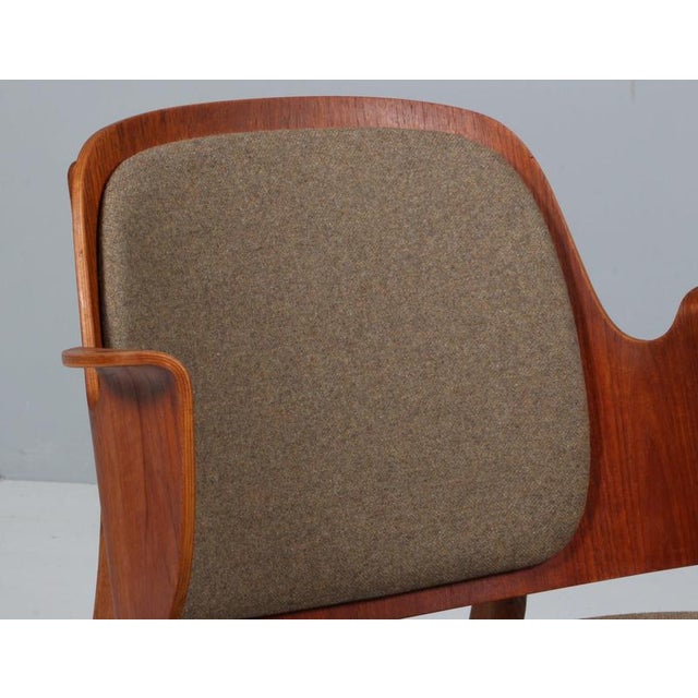 Hans Olsen lounge chair with frame of oak. Back of teak. Seat new upholstered with wool fabric. Model 107, made by Bramin....