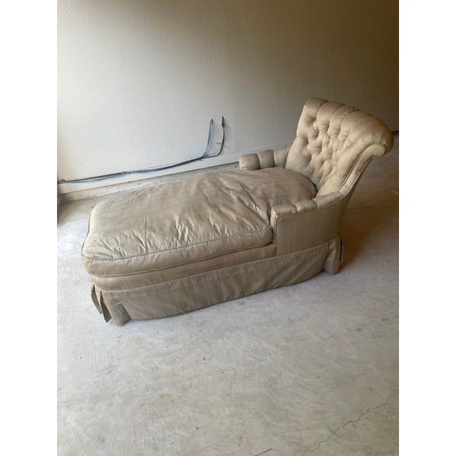 Vintage upholstered chaise lounge with tufted back and full flat pleat skirt. Current upholstery is a silk blend. No nicks...