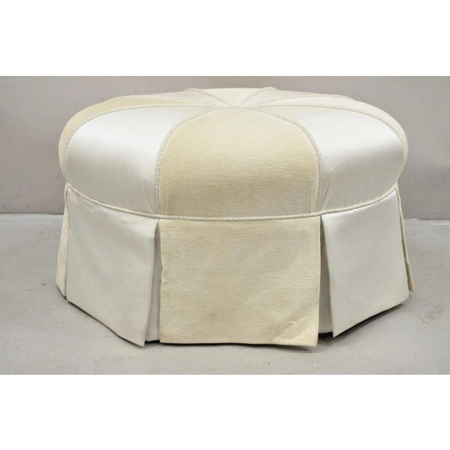 Decorator Modern Beige Upholstered Button Tufted Skirted 35" Round Ottoman. Item features black lacquered wooden legs,...