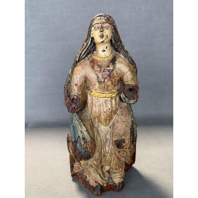 Seated Virgin Portuguese school S. XVIII , carved wood and polychrome scraps , 32 x 14 x 10 cm. I have official proof of...