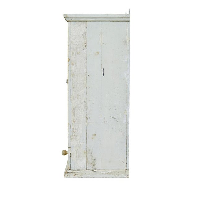 Scandinavian 19th century pine wall cupboard circa 1890. Rustic painted swedish wall cupboard made in pine. Top coat of a...