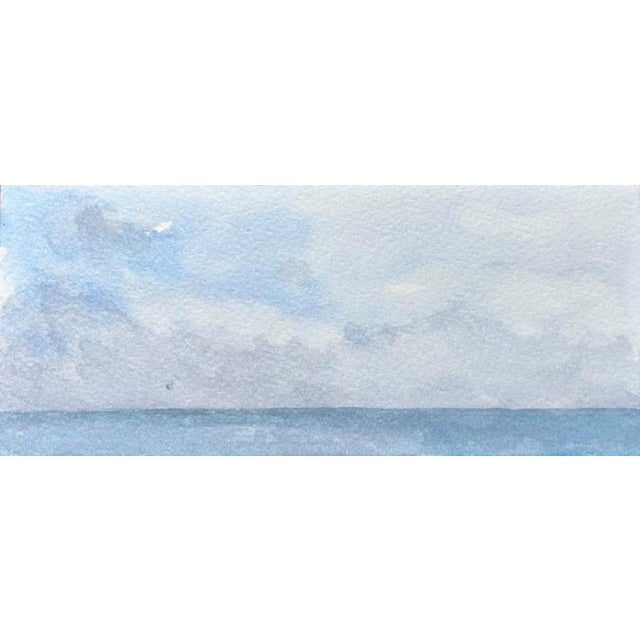 Fregene VI captures a serene seascape, where soft blues and grays blend seamlessly to evoke a tranquil atmosphere. The...