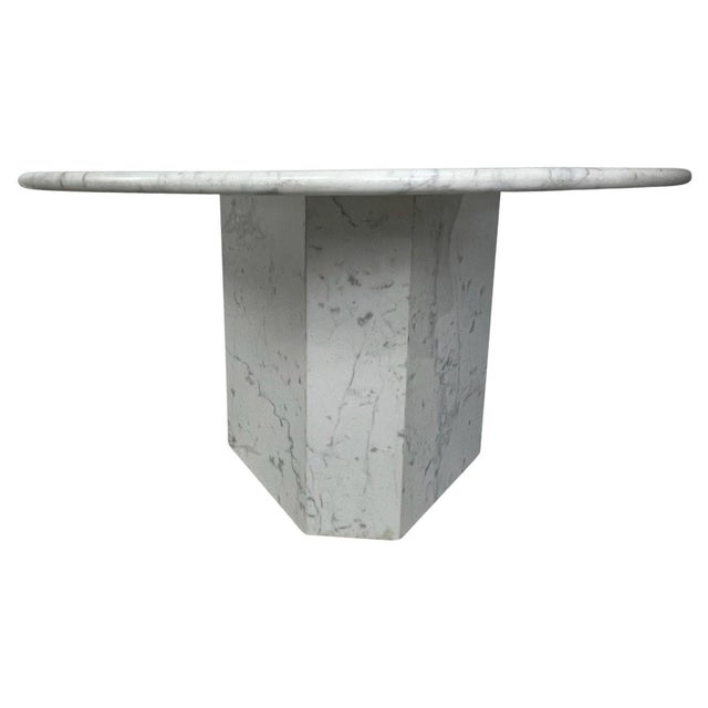 Very special solid white Carrara marble round dining, foyer, or kitchen table with a 3-sided polygon base. This table was...