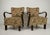 Elegant pair of upholstered club armchairs featuring sculptural bentwood armrests and decorative floral-pattern...