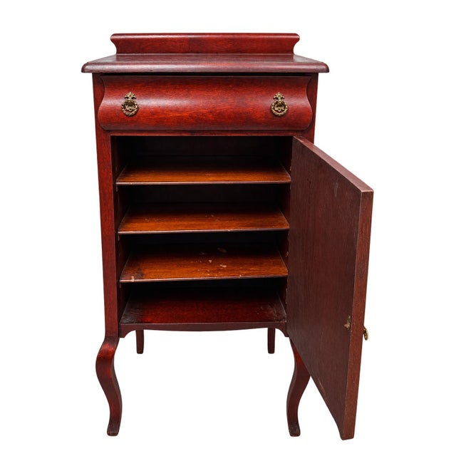Elegant Edwardian-era mahogany sheet music cabinet dating to approximately the early 20th century. This handsome piece...