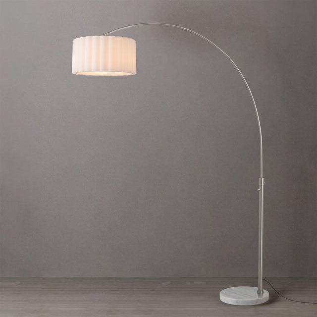 The Scallop 92" Arc Lamp is a modern masterpiece designed by Peter Morelli in 1960. This striking arc lamp features a...