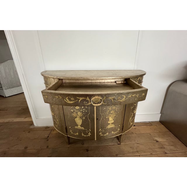 An extraordinary example of fine luxury cabinetry, this Neoclassical style commode by Theodore Alexander exemplifies...