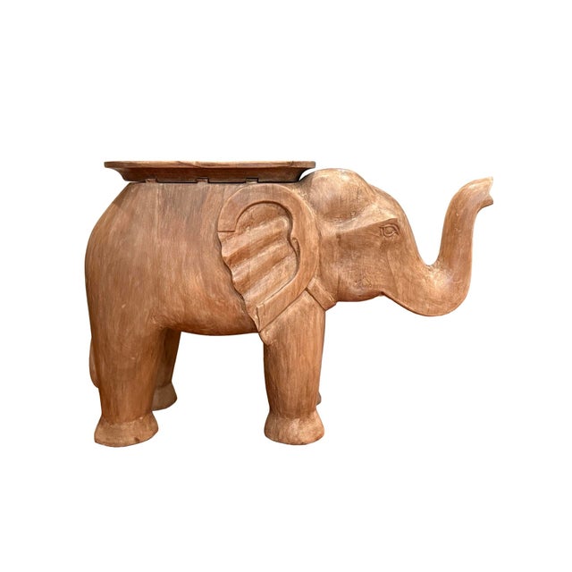 A charming and substantial hand-carved solid wood elephant side table from Pottery Barn Kids, no longer available in this...