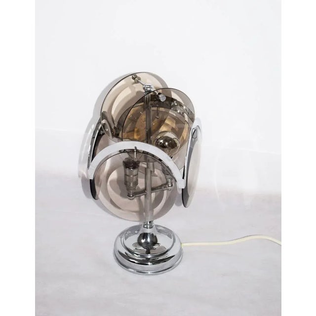 Table lamp: chrome -plated brass; 6 glass panels made of smoked glass. 2 lamp base E14 I have official proof of...