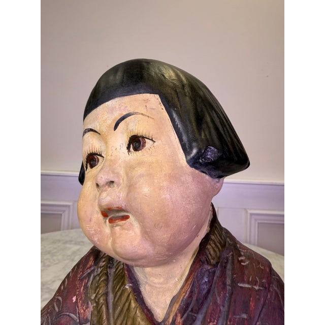 A captivating piece of early 20th-century American decorative art, this antique polychrome chalkware figurine depicts a...