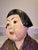 A captivating piece of early 20th-century American decorative art, this antique polychrome chalkware figurine depicts a...