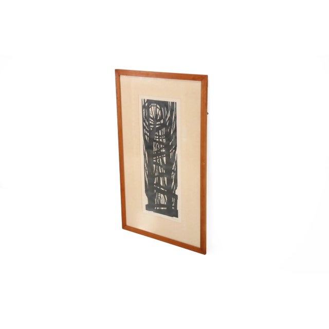 A powerful abstract woodcut from 1963 with a vertical composition of interwoven lines and forms reminiscent of trees or a...