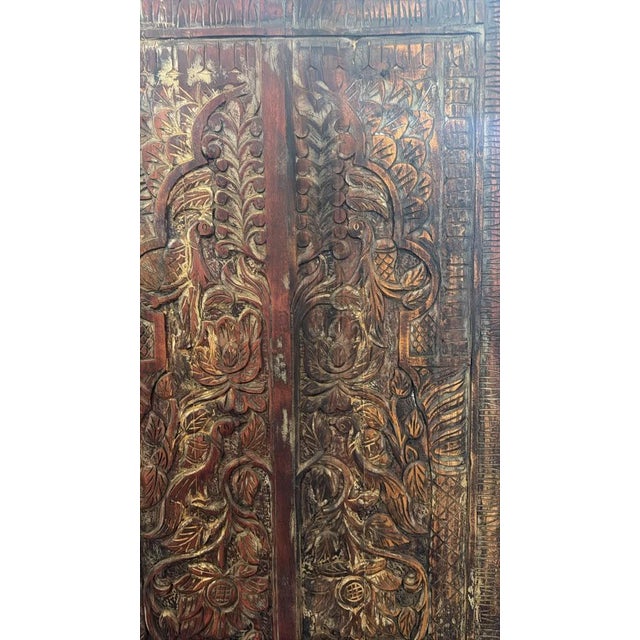 Bring timeless rustic elegance to your space with this beautifully carved antique-style wood door panel featuring a...