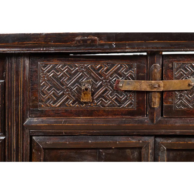 Chocolate Chinese Ming Dynasty Style Butterfly Cabinet with Carved Spandrels and Doors For Sale - Image 8 of 13