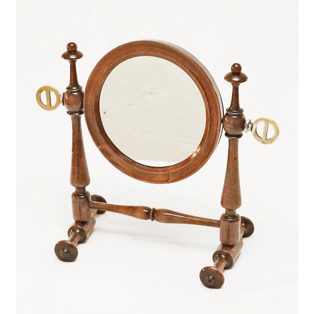 Historicist Standing Mirror Historicist table/standing mirror, circa 1880. Turned columns and base. Swivel mirror. Brass...