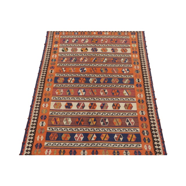This vintage 5x10 Persian kilim is a mid-century flat weave believed to originate from the Qashqai tribe. Handwoven in...
