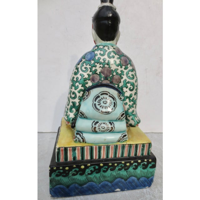 Antique Japanese Kutani ceramic figure. Polychromed image of a Shogun or other high official. This is a bright polychrome...