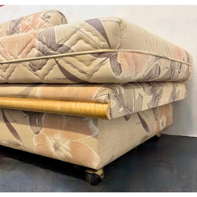 This is a vintage mid-century modern rattan daybed and sleeper sofa, manufactured around the 1970s. It is characterized by...