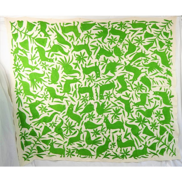 Fabulous hand-embroidered tapestry of various wild animals amongst flowers and leaves in a random decorative pattern on...