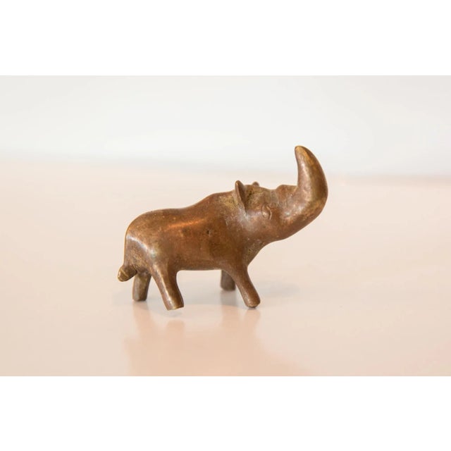 :: Vintage handmade copper casting of a medium sized rhinoceros. Circa mid 20th century and possibly older, this piece has...