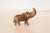 :: Vintage handmade copper casting of a medium sized rhinoceros. Circa mid 20th century and possibly older, this piece has...