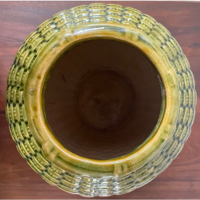 Large, handmade, embossed basketweave ceramic vessel. The glaze is a vibrant green similar to apple green, emerald green,...