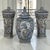 A striking set of three hand-painted ceramic lidded vases by Boch Frères Keramis, combining distinctive European...