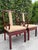 A handsome pair of Chinese Ming-style armchairs crafted in richly grained rosewood-toned hardwood. The chairs feature...