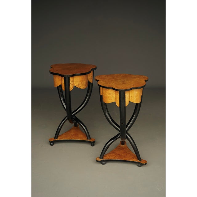A pair of very decorative side tables that would also work well as bedside tables or lamp tables. Each has a small shallow...