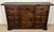 Attractive Spanish hardwood sideboard featuring a classic paneled door design and three upper drawers, enhanced with...