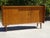 Three-door sliding sideboard produced by Société Auxiliaire du Meuble (S.A.M), established in Bordeaux in the 1950s. An...