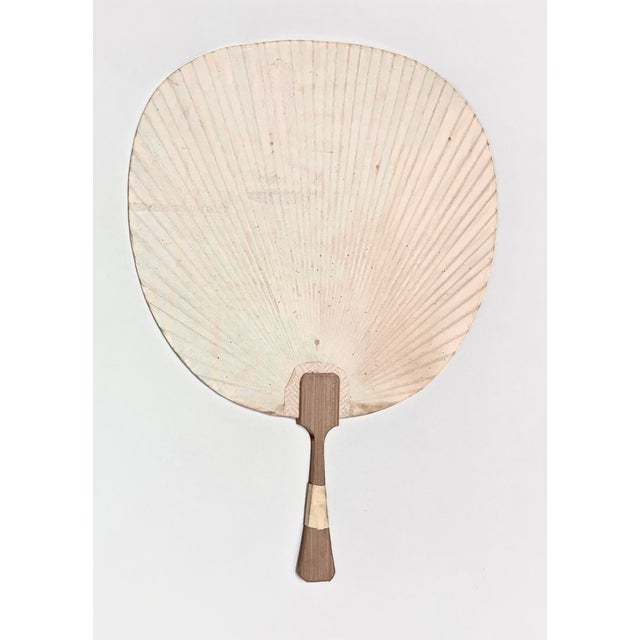 Mid-century Japanese rigid fan featuring a stylized botanical reed or cattail motif. Purchased in Japan between 1959–1961...