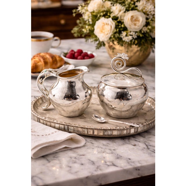 An exceptional and highly desirable vintage creamer and covered sugar bowl set designed and handcrafted in Taxco, Mexico...