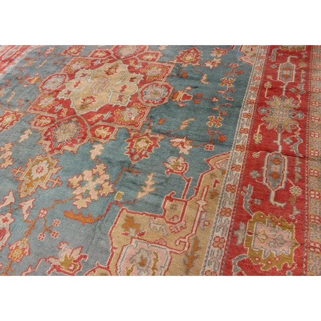 Antique Turkish Oushak Rug on a Blue Background and Orange-Red Color Border For Sale In Atlanta - Image 6 of 12