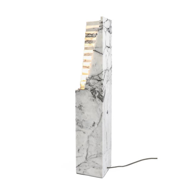 Amphitheatre lamp in marble. It gives a distinct and elegant touch to your house. Each piece is in a way unique (every...