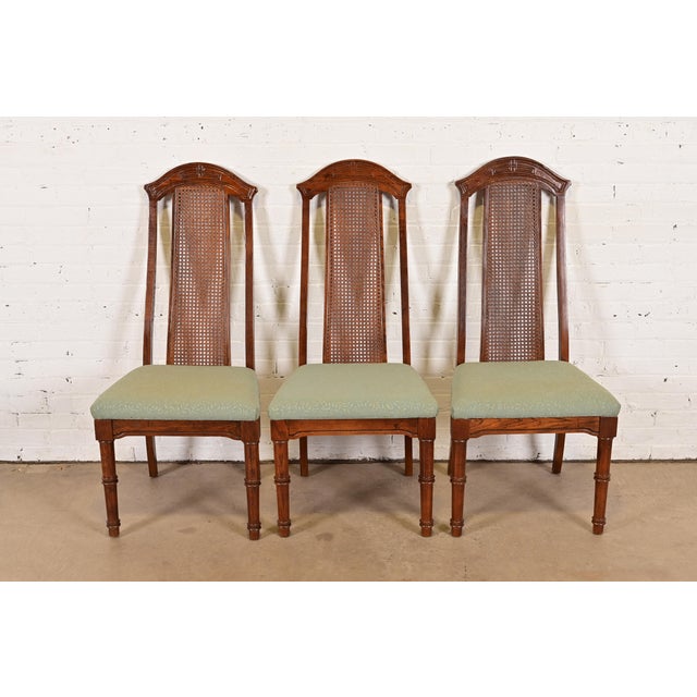 A gorgeous set of three Mid-Century Modern Hollywood Regency Chinoiserie high back side chairs or dining chairs In the...