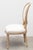 Oval back Louis XVI side chair in distressed and dry brushed light finish. Neutral upholstrey with tack trim and...
