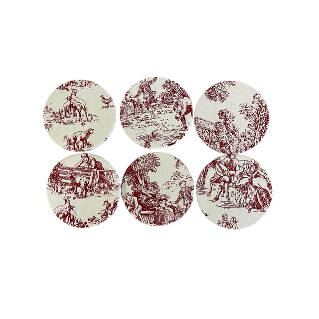 A charming set of six 4-inch coasters crafted with Busatti fabric in a timeless red and white toile pattern. Each coaster...