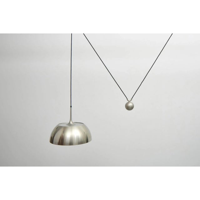 Florian schulz pendant lamp 1970s the shade's height can be adjusted using its weight. The shade features a glass plate at...