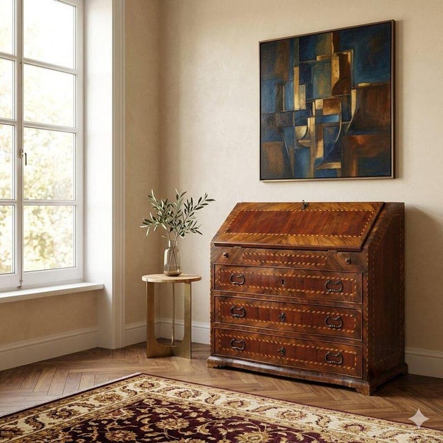 Rosewood and mahogany drop-leaf chest with alternating maple and rosewood trim. The upper drop-leaf door conceals a...