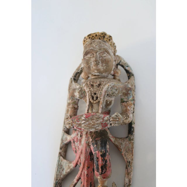 India carved dancing figure. painted and standing on an elephant.