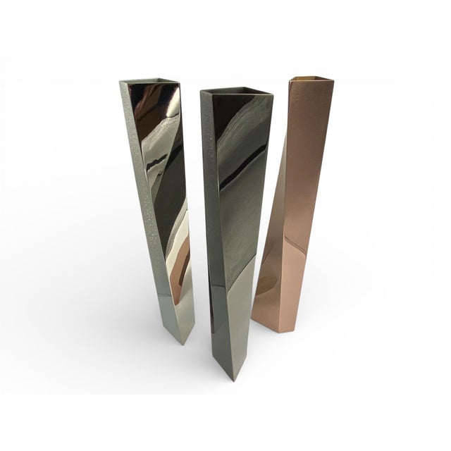 A sculptural set of three Crevasse vases designed by Zaha Hadid for Officina Alessi, introduced in 2005 as part of a...