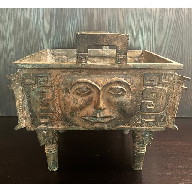 An imposing, museum-scale archaistic Chinese bronze square ritual vessel (Fang Ding), intricately modeled after the...