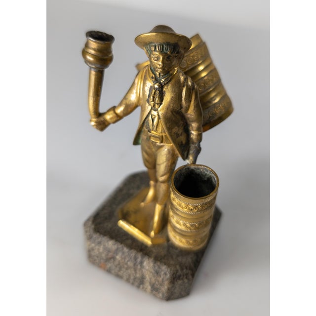 We are selling this cool Continental European gilt bronze table lighter. This table lighter is in the form of a street...