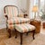 An early 20th century Italian bergere armchair with matching footstool in a French Louis XV (Rococo) style, made in Italy....