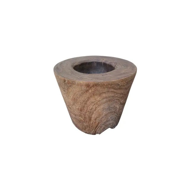 A vintage mortar bowl soured from rural Java & crafted from a solid teak wood slab. A raw and organic object with...