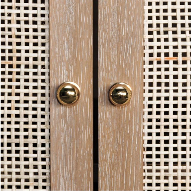 New special order item. British West Indies style with a modern flair, this chic occasional cabinet showcases natural,...