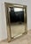 Elegant wall mirror featuring a sophisticated brass frame with decorative beaded detailing and beautifully beveled...