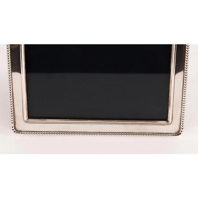 A superb decorative sterling silver photo frame with makers mark RBB and hallmarks for Sheffield 1990. Beautiful portrait...